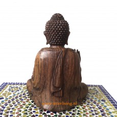 Zittend boeddha beeld van hout in lotus meditatie met mudra hand