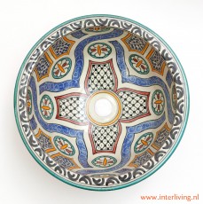 Marokkaans sanitair van keramiek: gekleurde wasbak met mozaiek tegelpatronen uit Fes. Ronde waskom wit